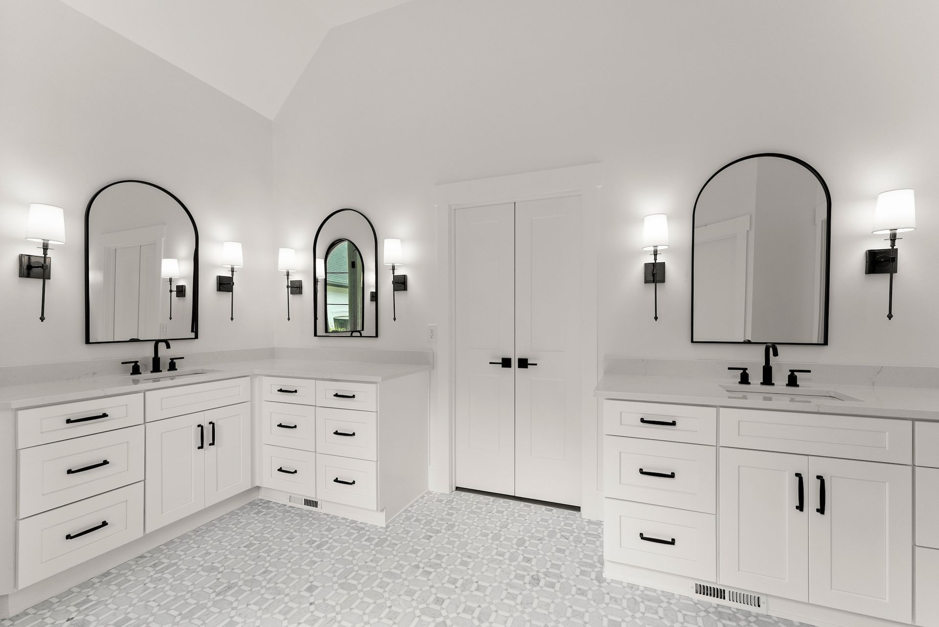 A bathroom with two sinks and two mirrors.