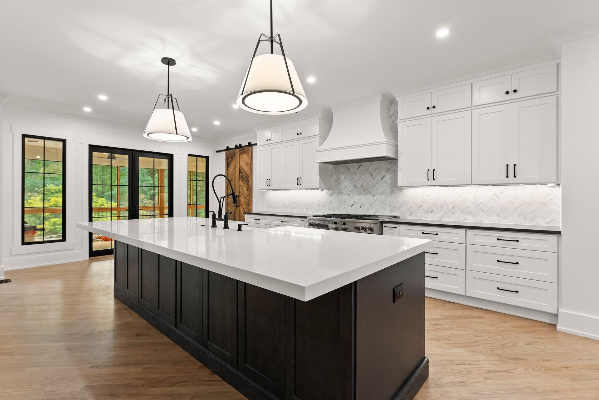 There is a large island in the middle of the kitchen.
