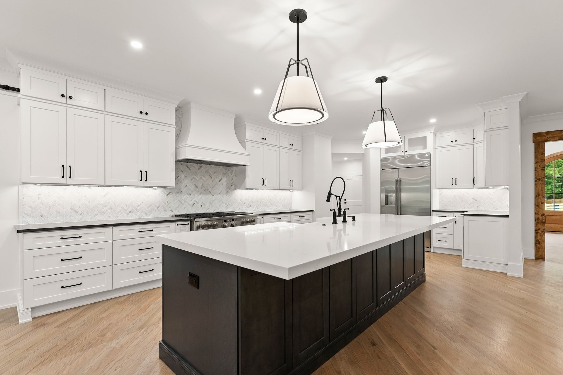 There is a large island in the middle of the kitchen.