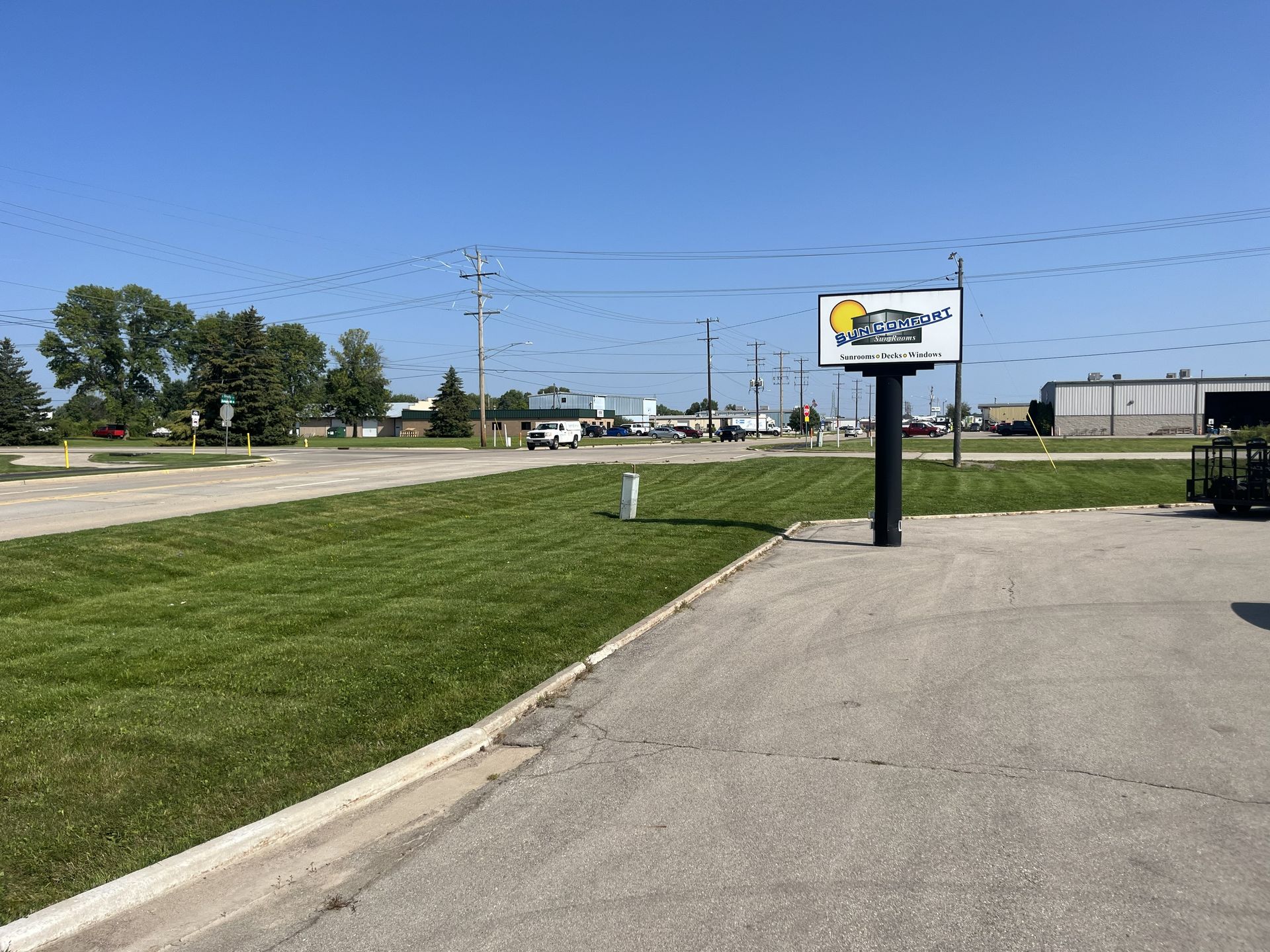 Grassy lot with a sign for 