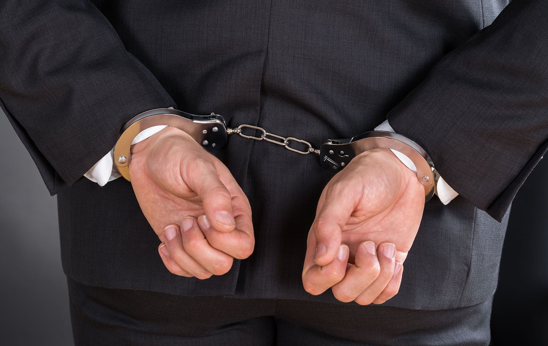 A man hands with a handcuffs