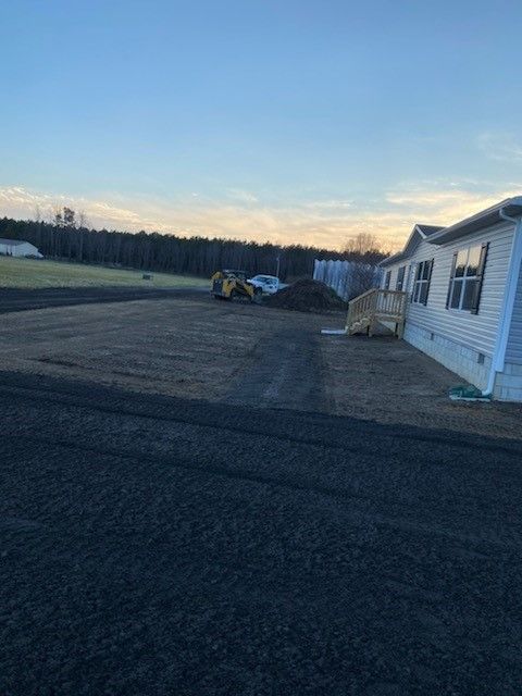 A house with a lot of dirt in front of it