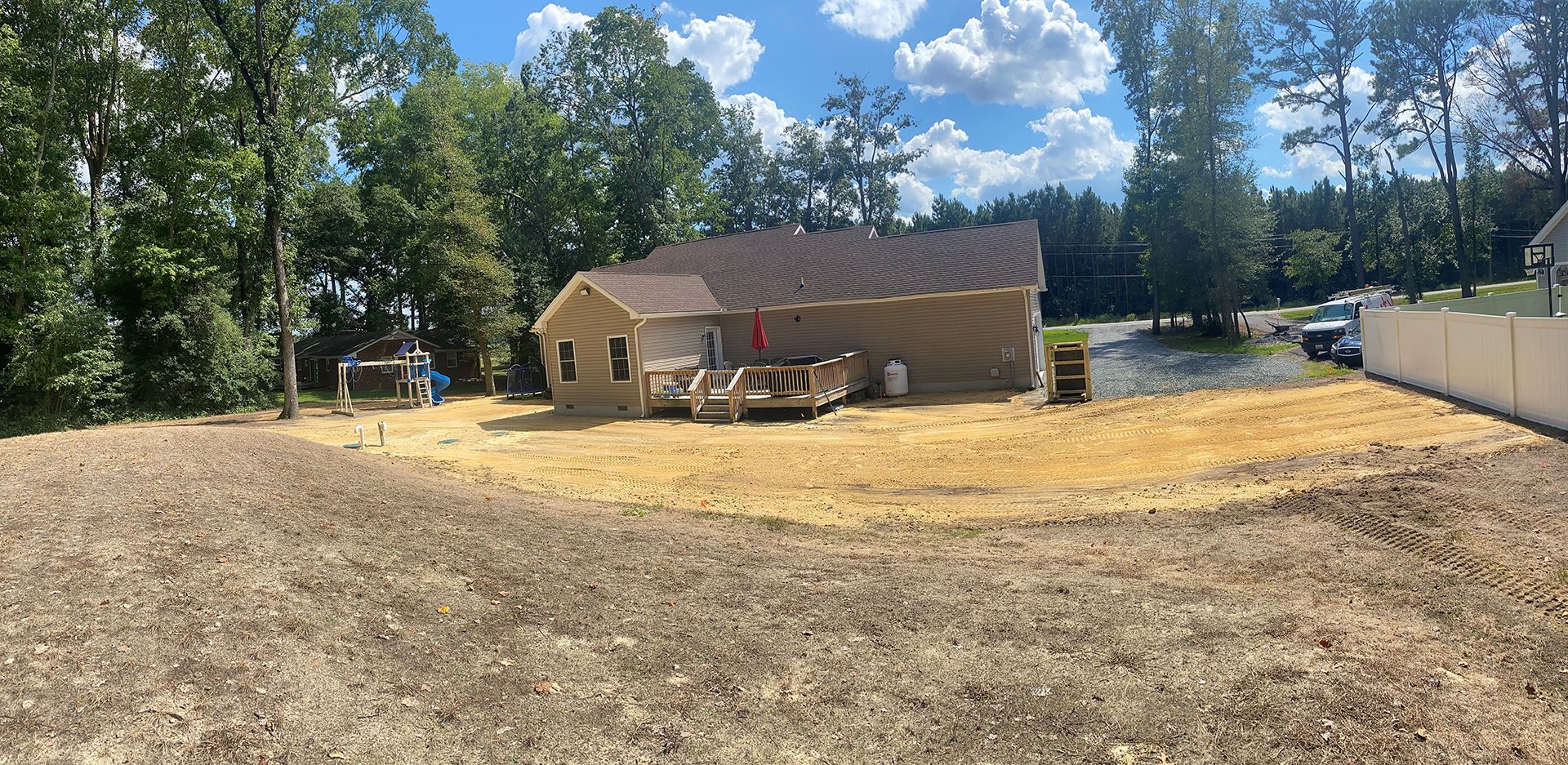 A house is being built in the middle of a dirt field