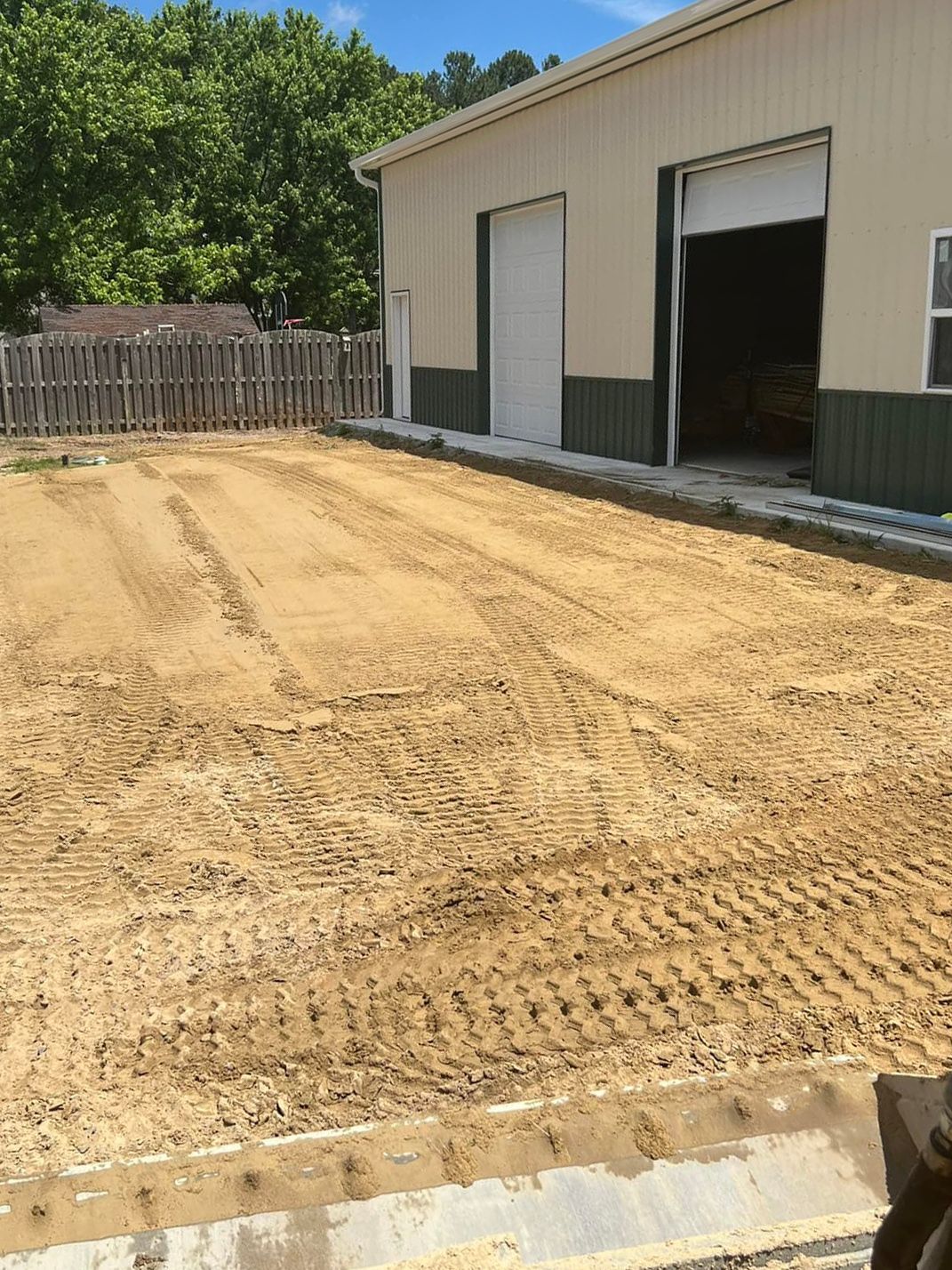 A large building with a lot of dirt in front of it.
