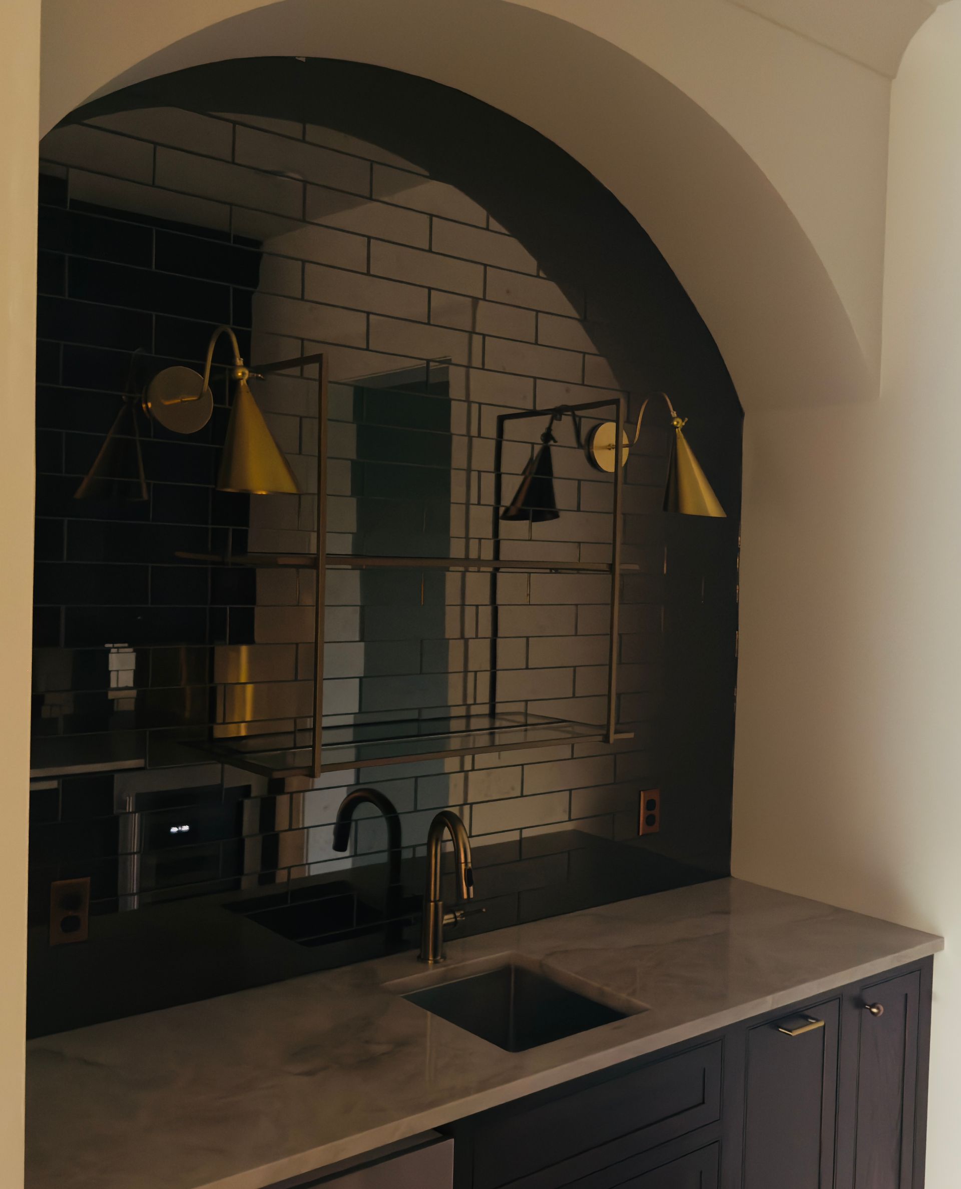 Modern bathroom with turquoise tile shower, white sink and toilet, and wood-look floor