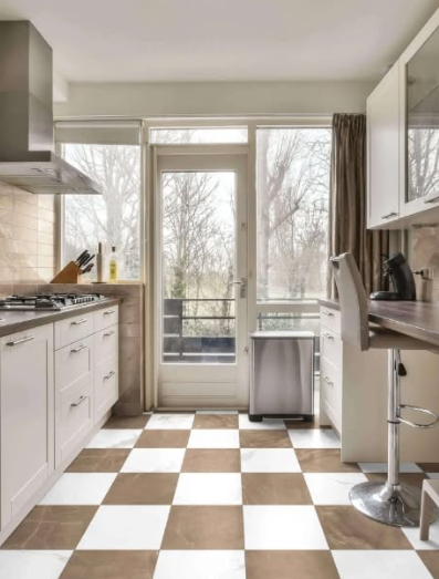 Bright kitchen with checkered floor, white cabinets, and a glass door opening to a balcony.