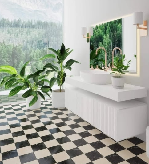 Bright bathroom with black-and-white checkered floor, white vanity, mirror, and potted green plants by a window