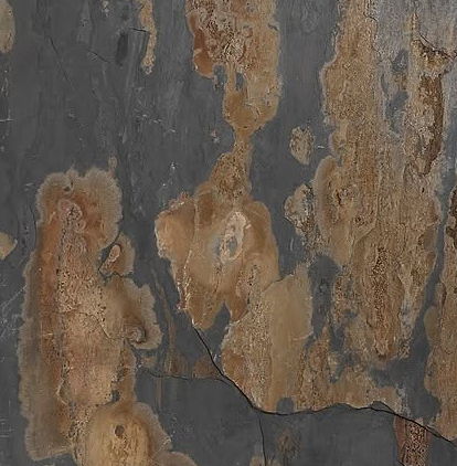 Weathered gray and rust-orange peeling paint on a cracked, textured wall surface