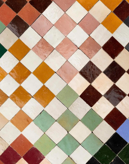 Colorful diamond mosaic of square tiles in orange, pink, green, brown, and blue tones