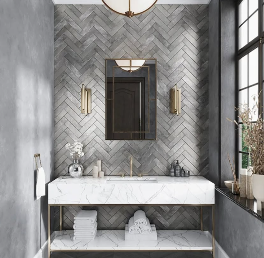 Modern gray bathroom with herringbone tile, floating white vanity, mirror, and tall windows