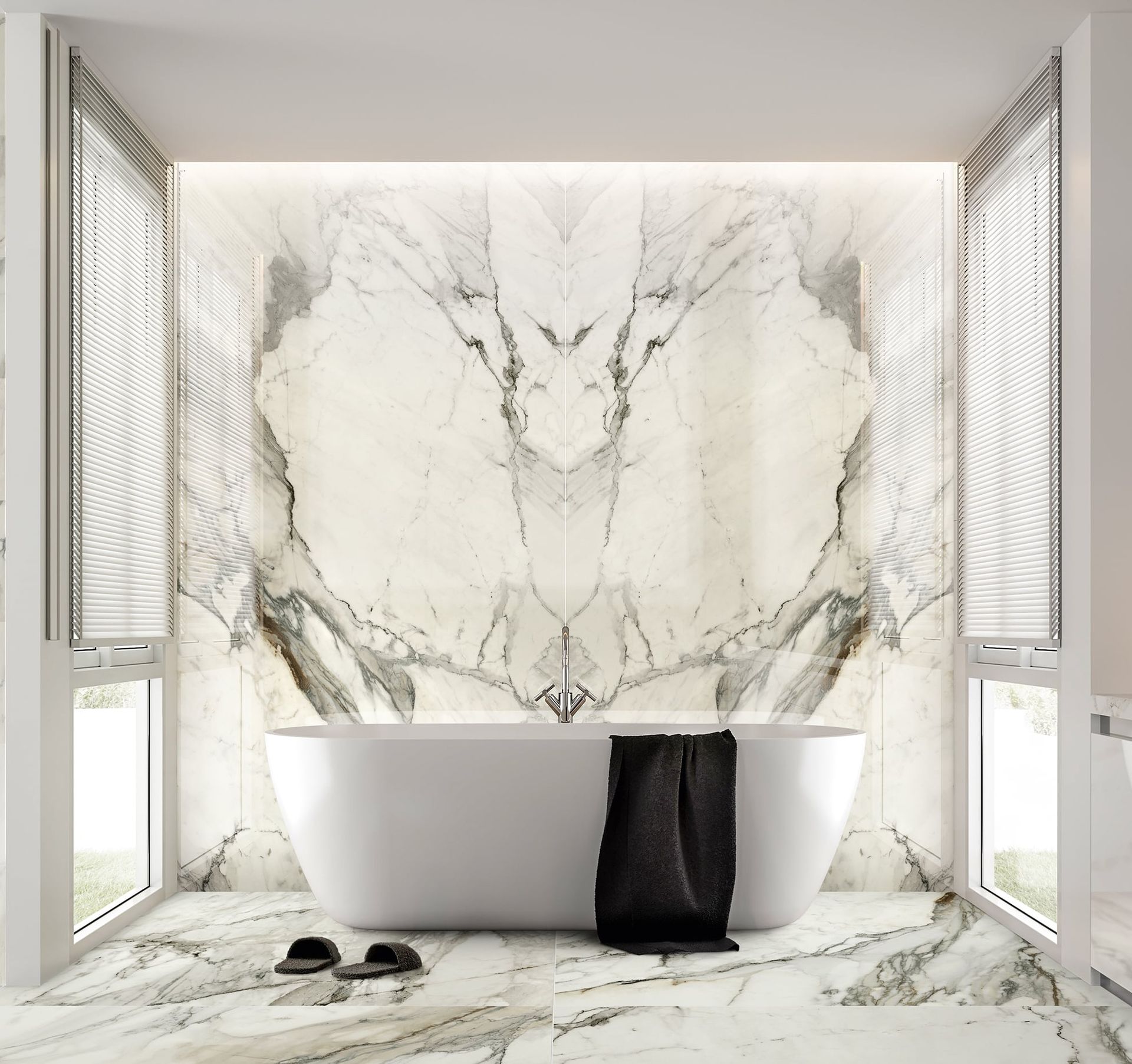 Modern gray bathroom with herringbone tile, floating white vanity, mirror, and tall windows