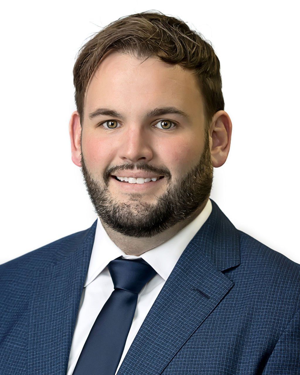 Man in suit smiles at the camera, against a white background.