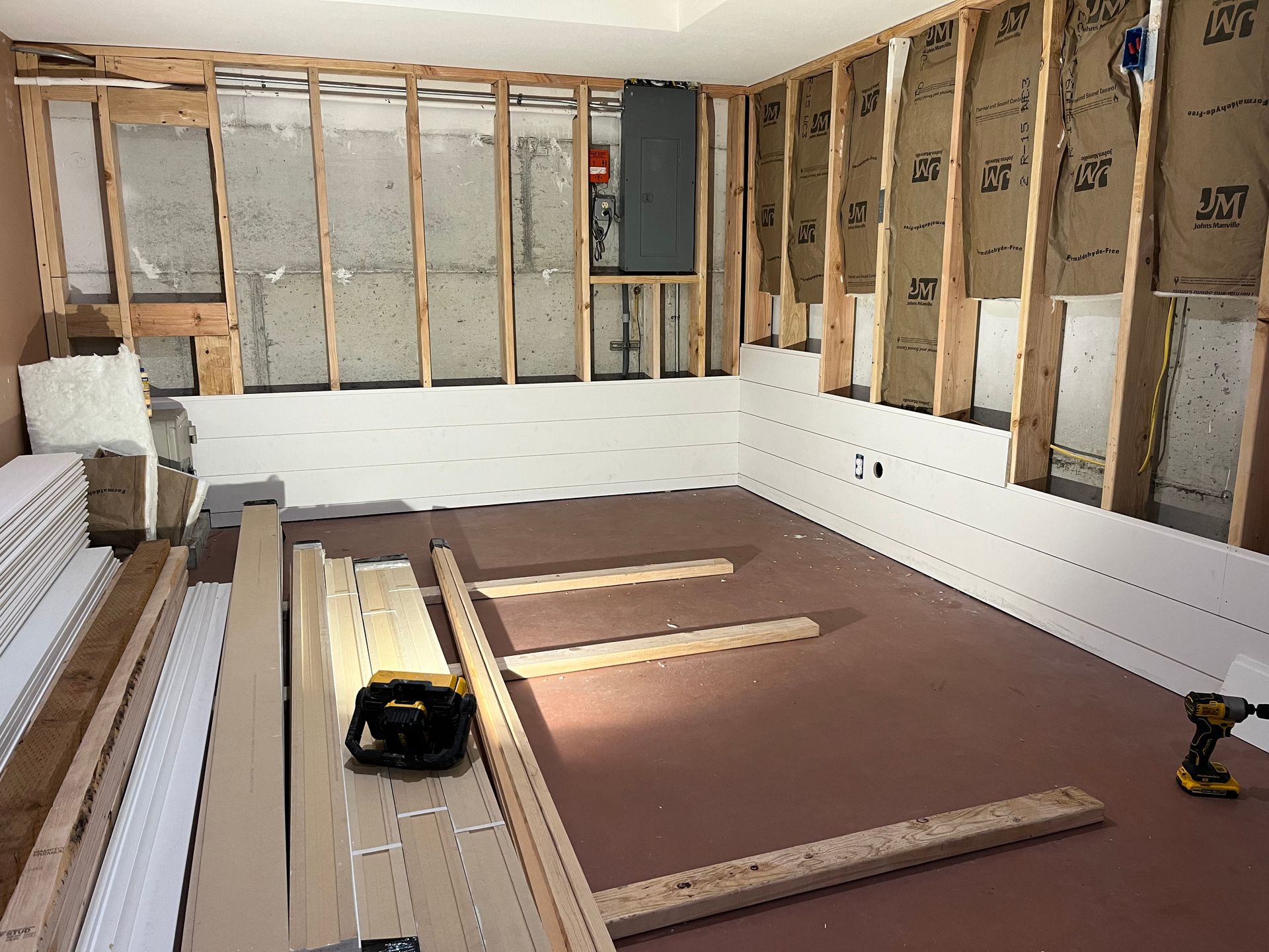 A room with a lot of wooden boards on the floor