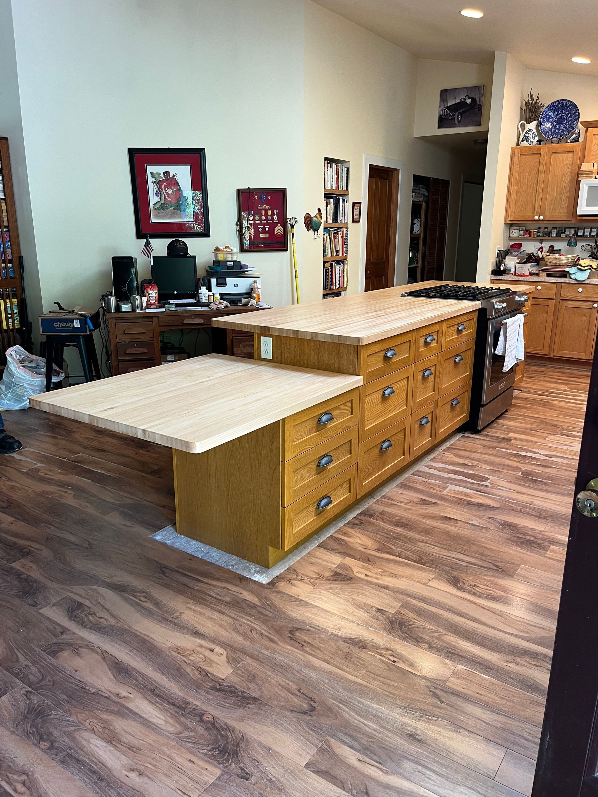 A kitchen with a large island in the middle of the room.