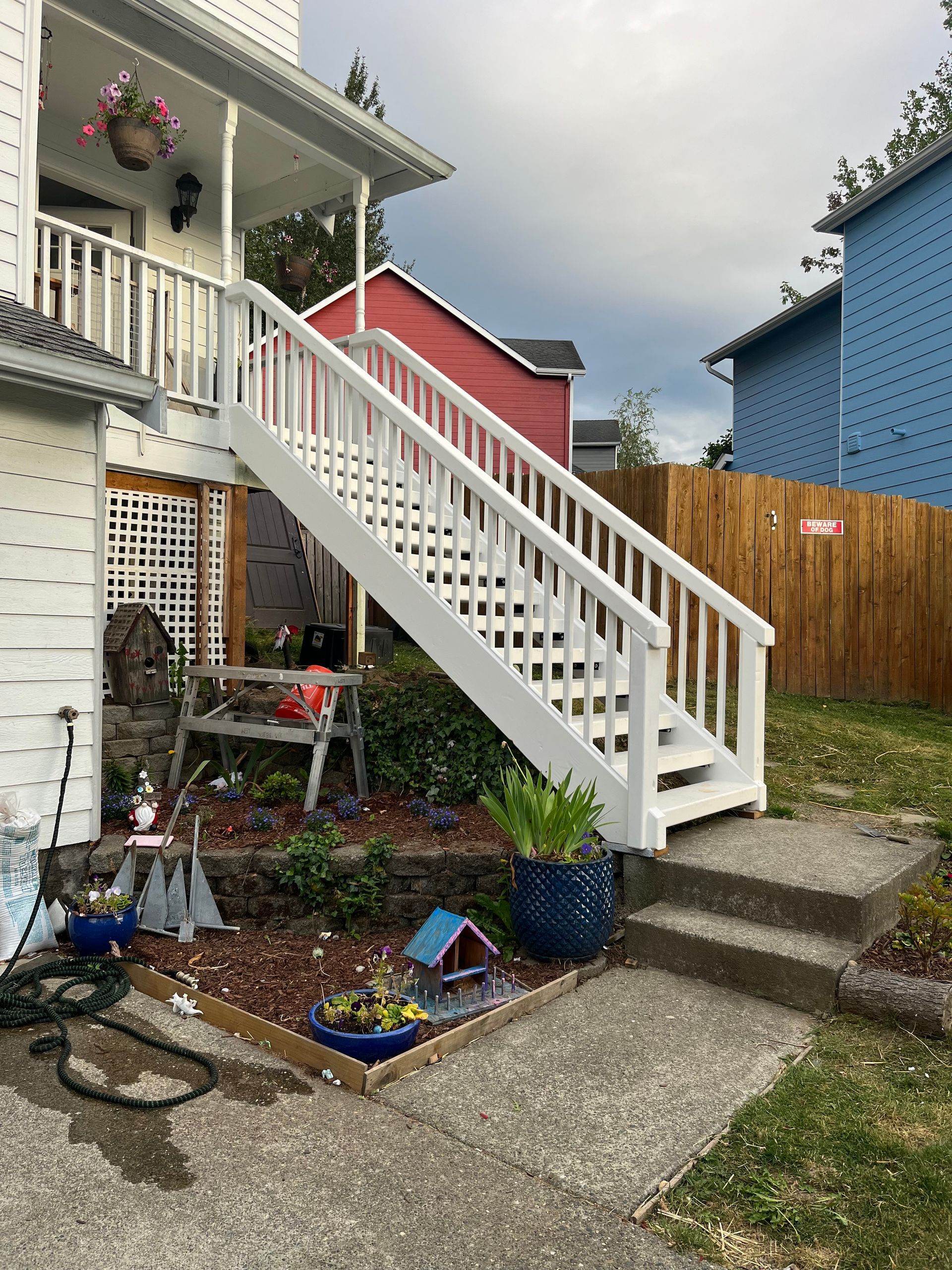 A white staircase leading up to the second floor of a house.