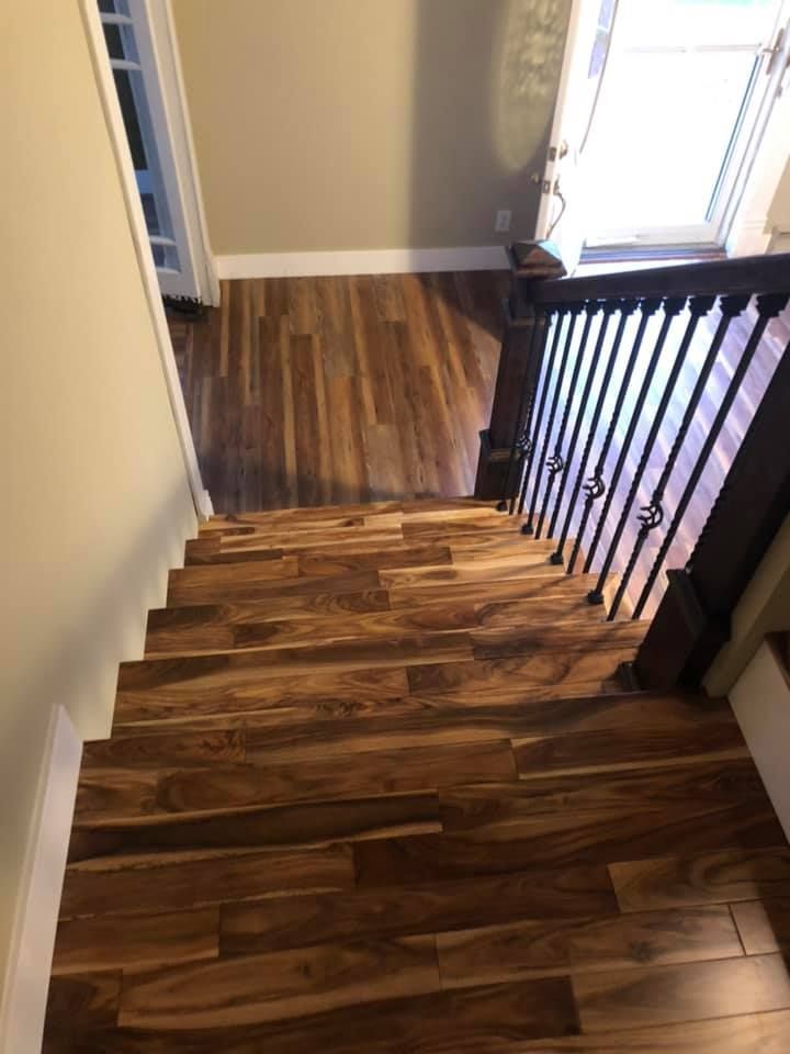 A set of wooden stairs leading up to a second floor in a house.