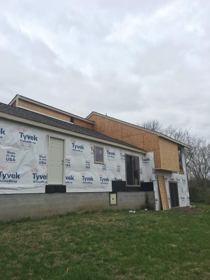 A house is being built with styrofoam on the side of it.