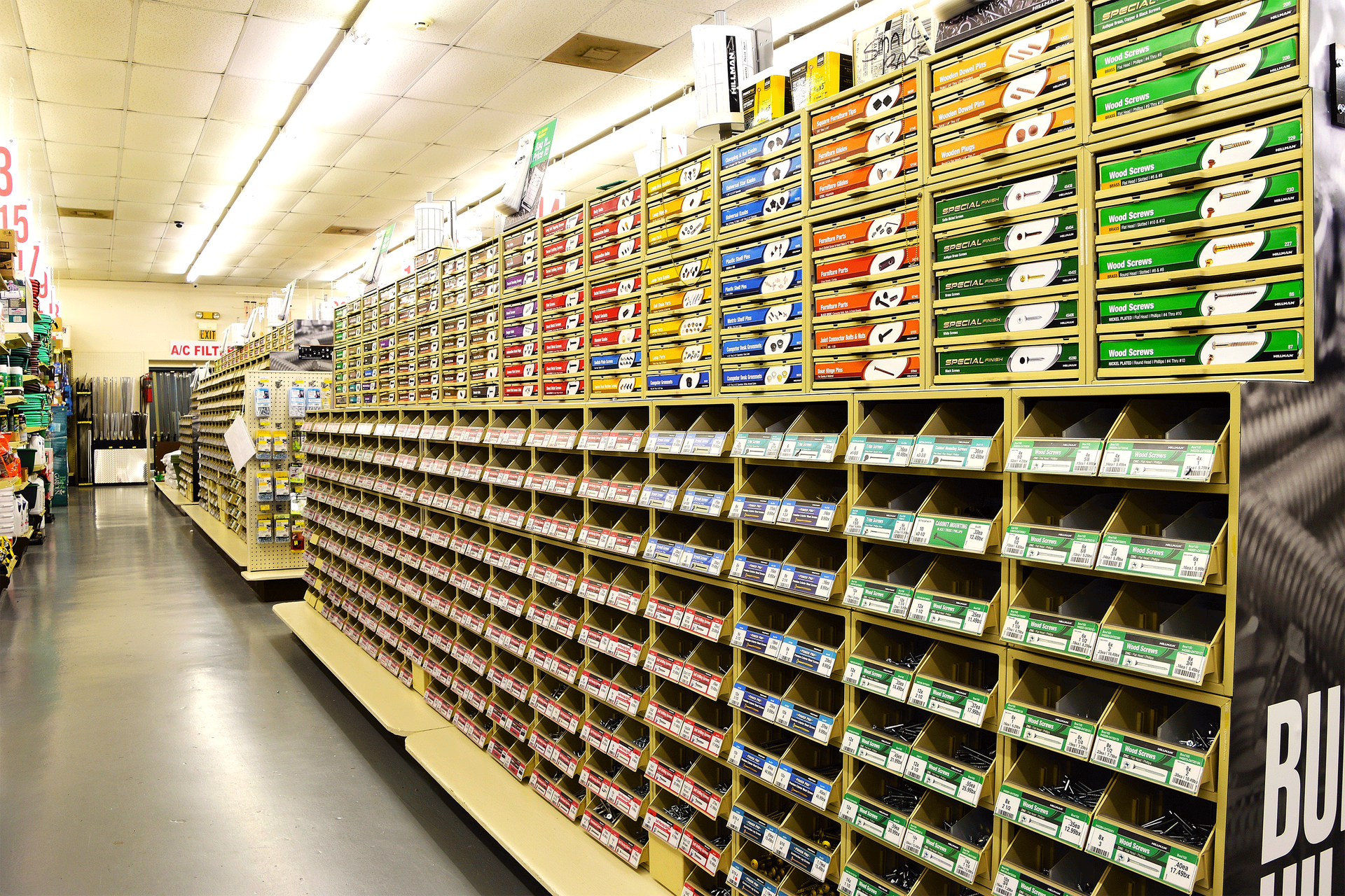 A store aisle filled with lots of shelves and boxes