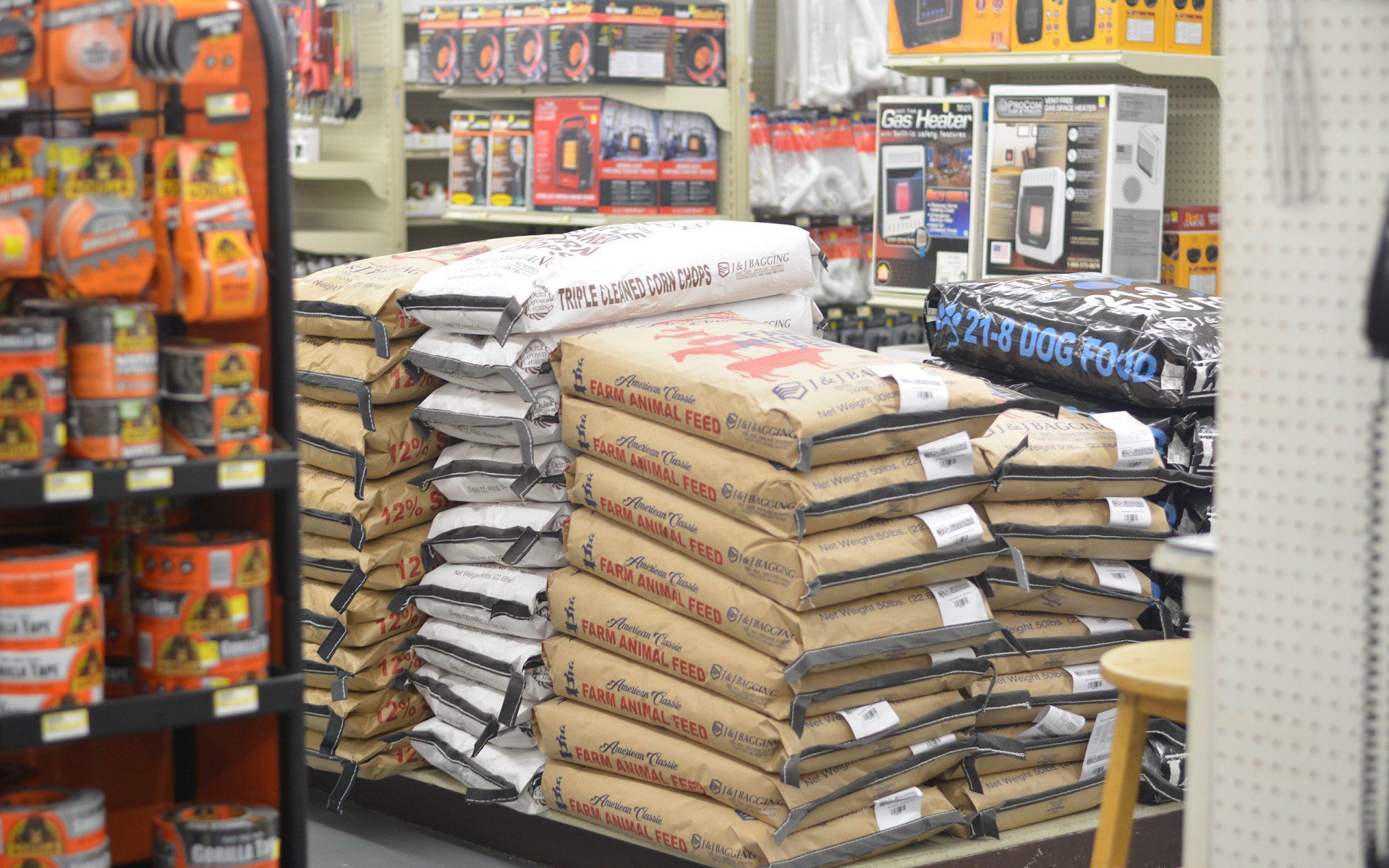 Bags of cement are stacked on top of each other in a store