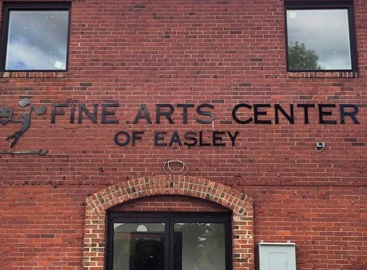 The fine arts center of easley is located on a brick building