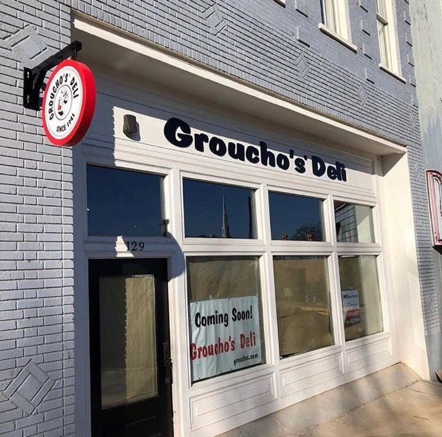 Groucho 's deli has a sign that says coming soon