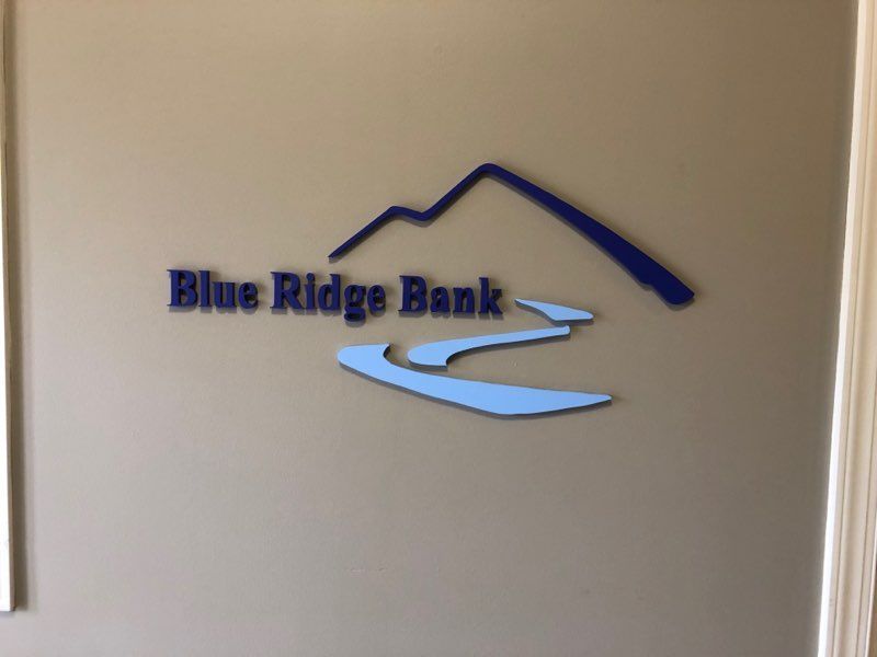 A blue ridge bank logo on a wall