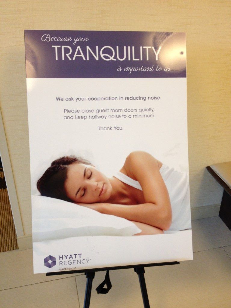 A poster of a woman sleeping with the words tranquility on it