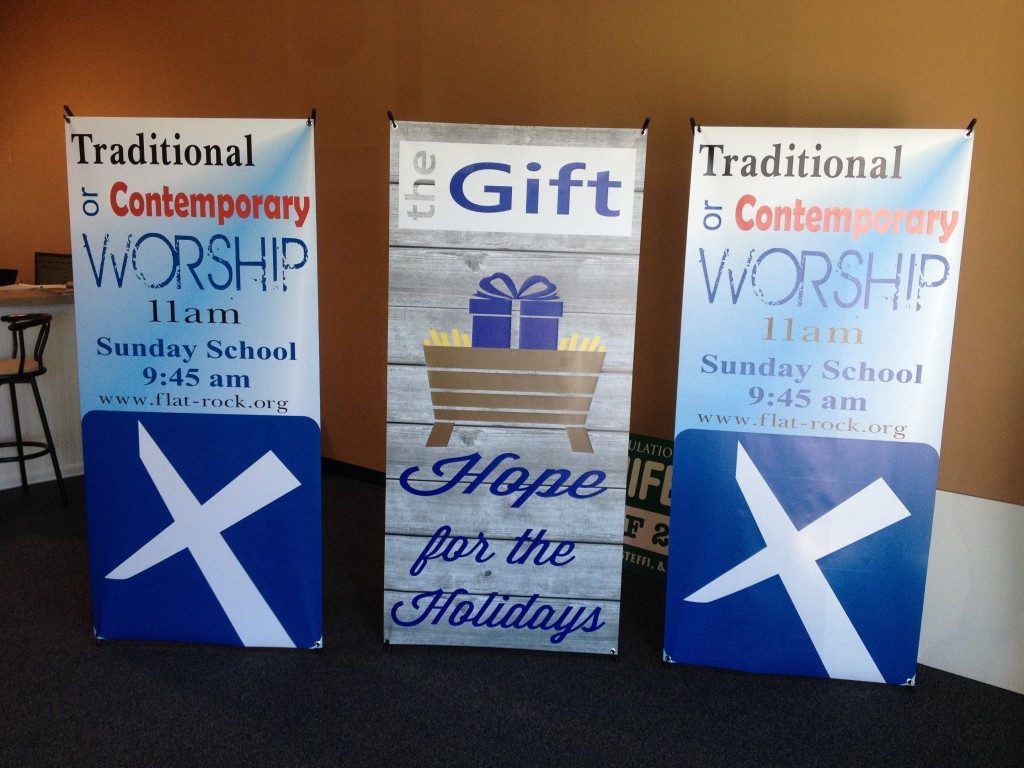 Three signs that say traditional contemporary worship hope for the holidays