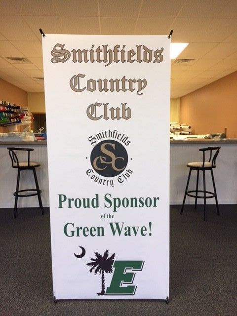 A banner for smithfields country club proud sponsor of the green wave