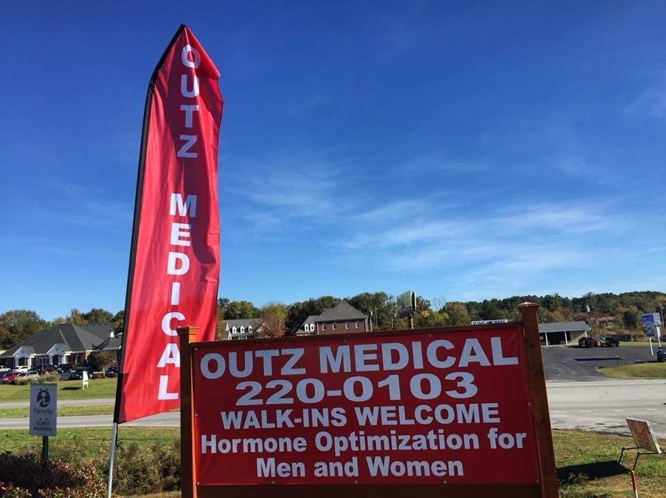 A sign that says outz medical 220-0103 walk ins welcome hormone optimization for men and women