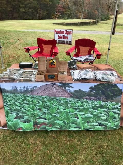 A table with a picture of a field of tobacco leaves on it.