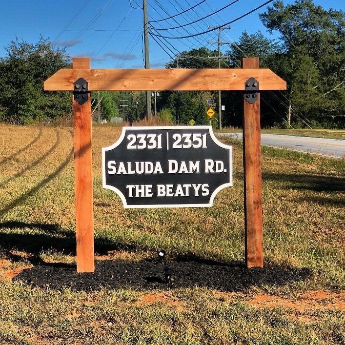 A sign that says 23312351 saluda dam rd the beatys