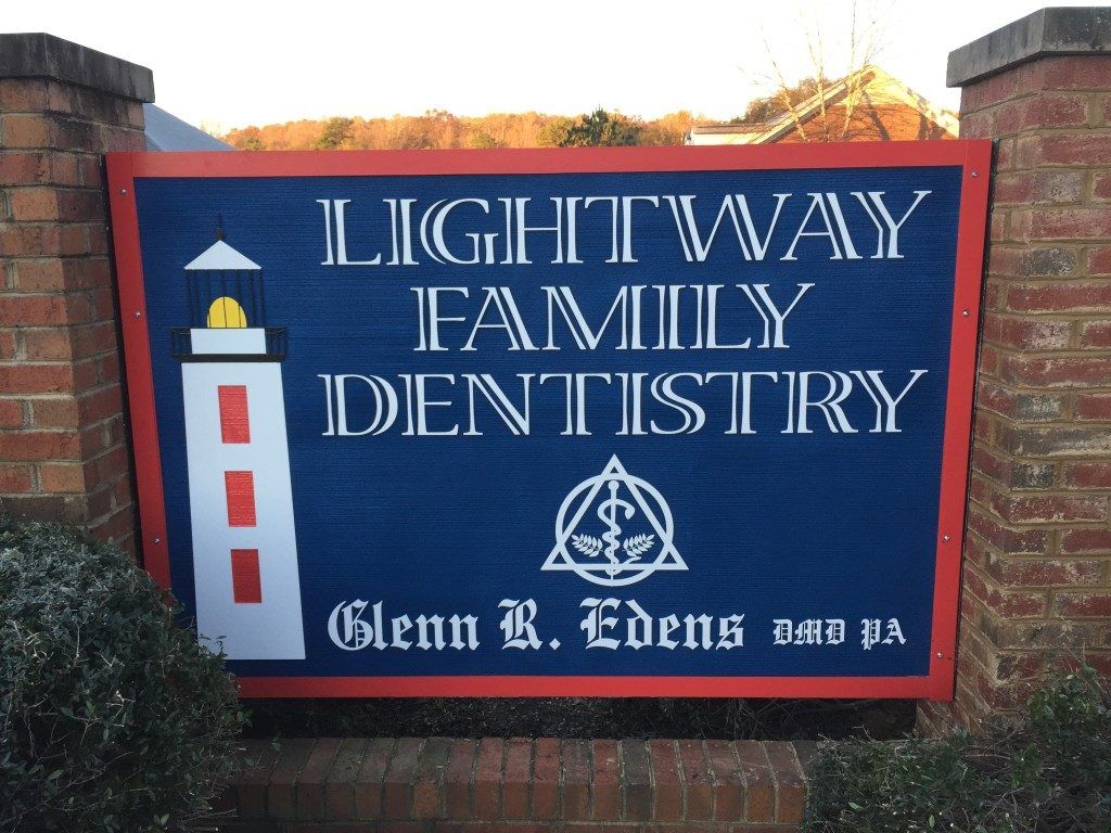 A sign that says lightway family dentistry on it