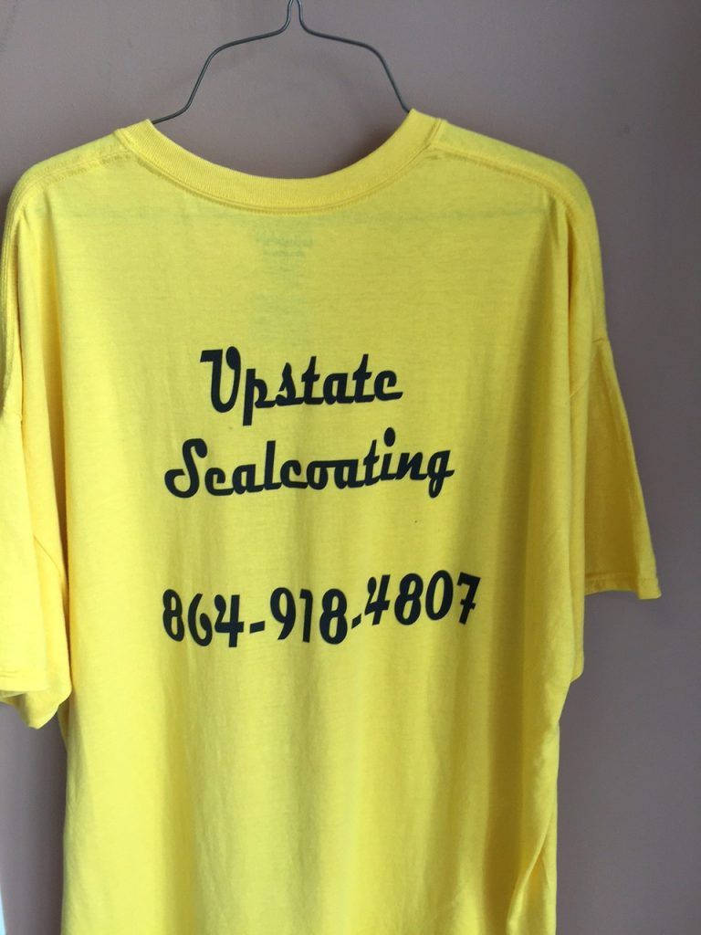 A yellow shirt that says upstate sealcoating on it