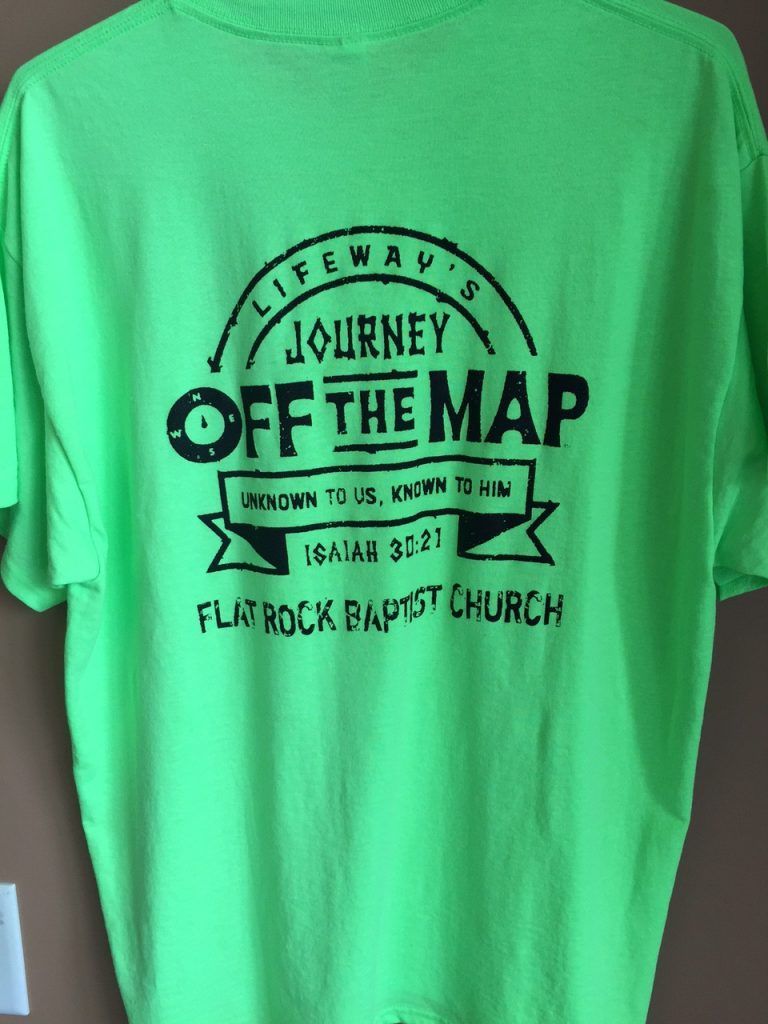 A neon green t-shirt that says journey off the map