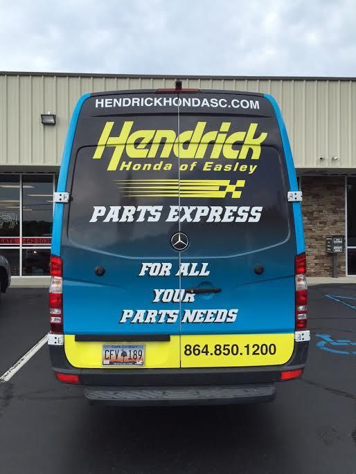 The back of a hendrick honda of easley parts express van
