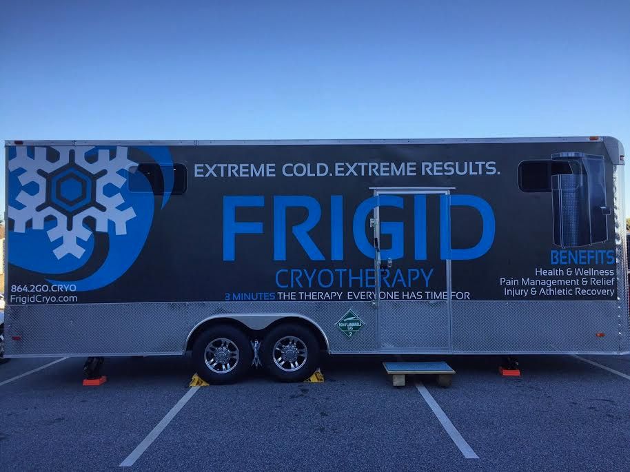 A frigid cryotherapy trailer is parked in a parking lot