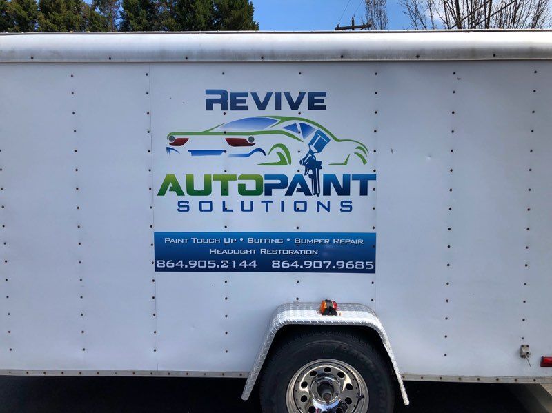 A white trailer that says revive autopaint solutions