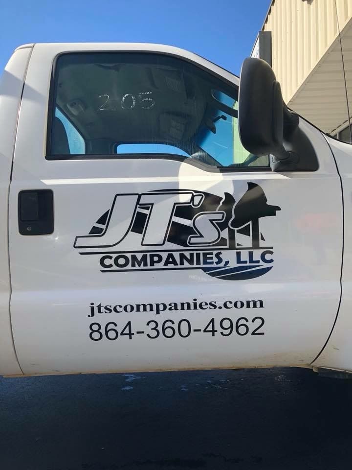 A white truck with jts companies llc written on the side