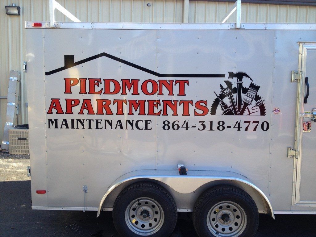 A trailer that says piedmont apartments maintenance on it