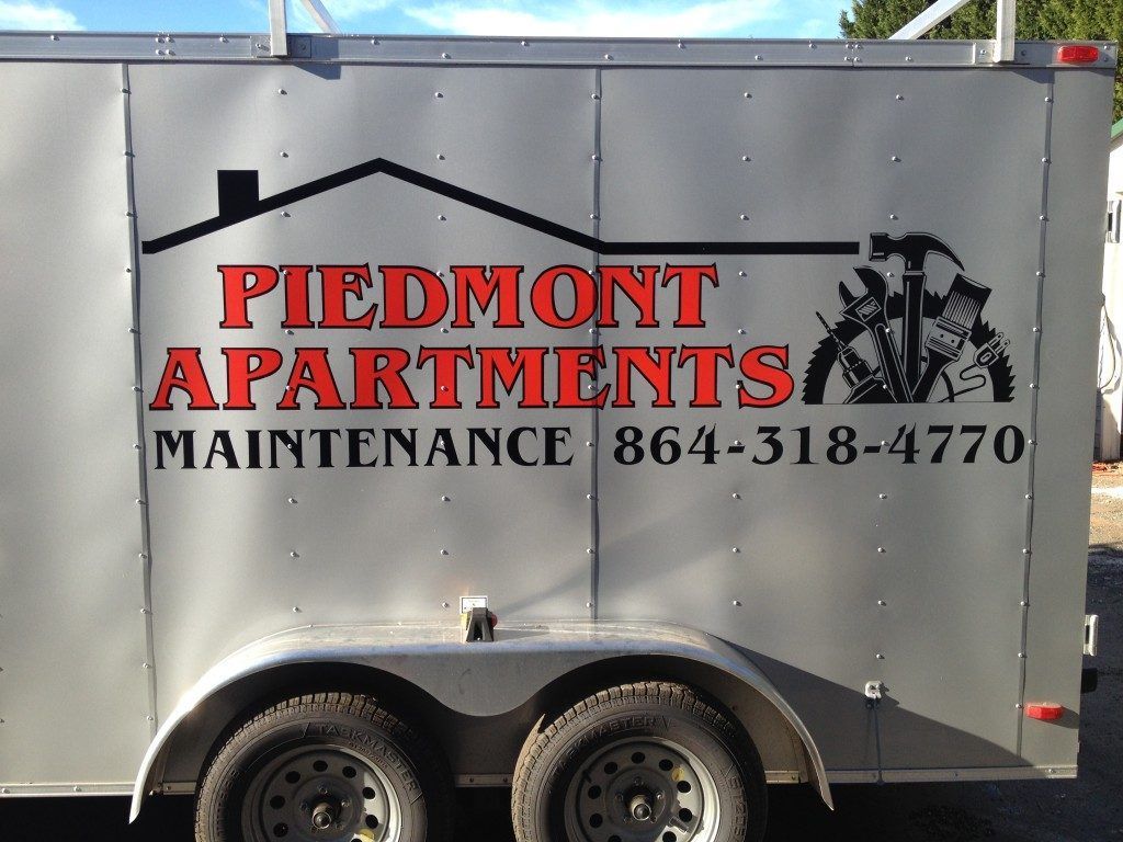 A trailer that says piedmont apartments on it