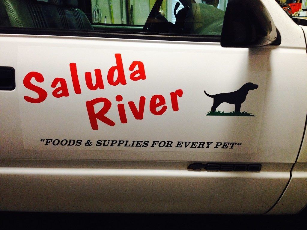 The side of a truck that says ' saluda river ' on it