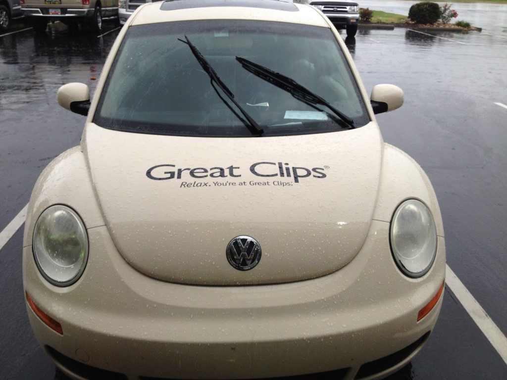 A white car with great clips written on the hood