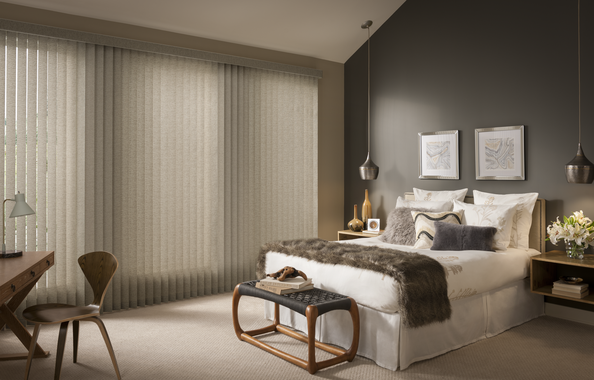 Bedroom with large window, bed, and desk. Beige vertical blinds, dark gray wall, neutral color scheme.