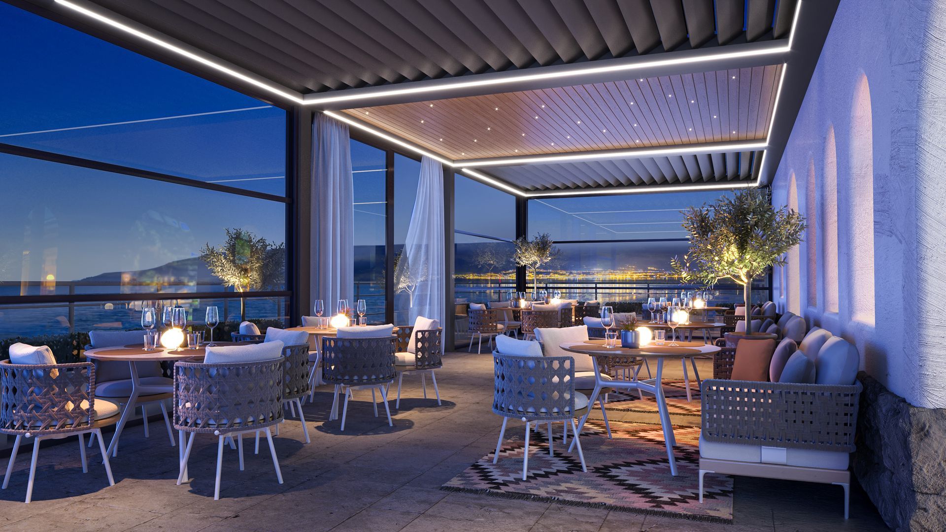 An artist 's impression of a patio with tables and chairs at night.