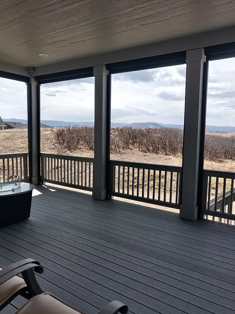 porch with a view of a field and mountains