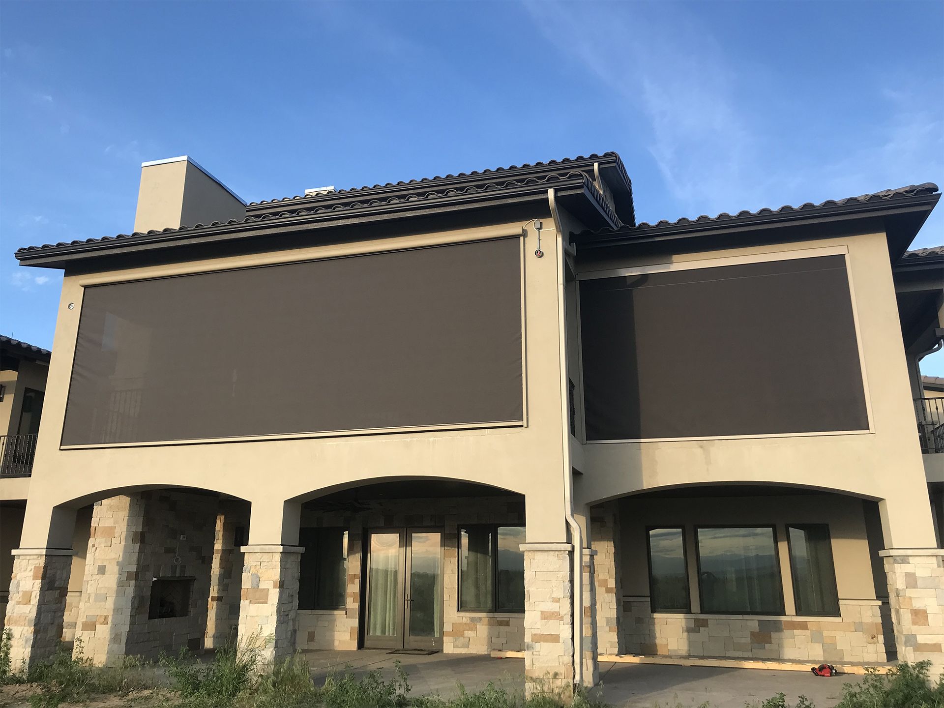 a large house with a large screen on the side of it