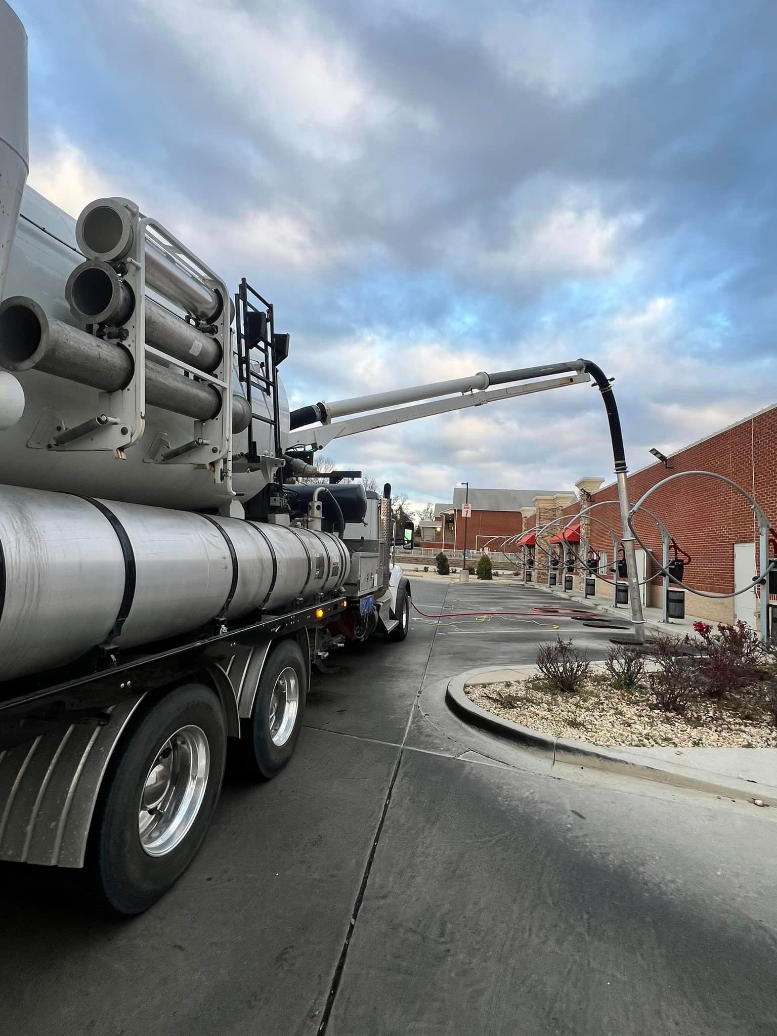 a concrete pump truck is parked on the side of the road
