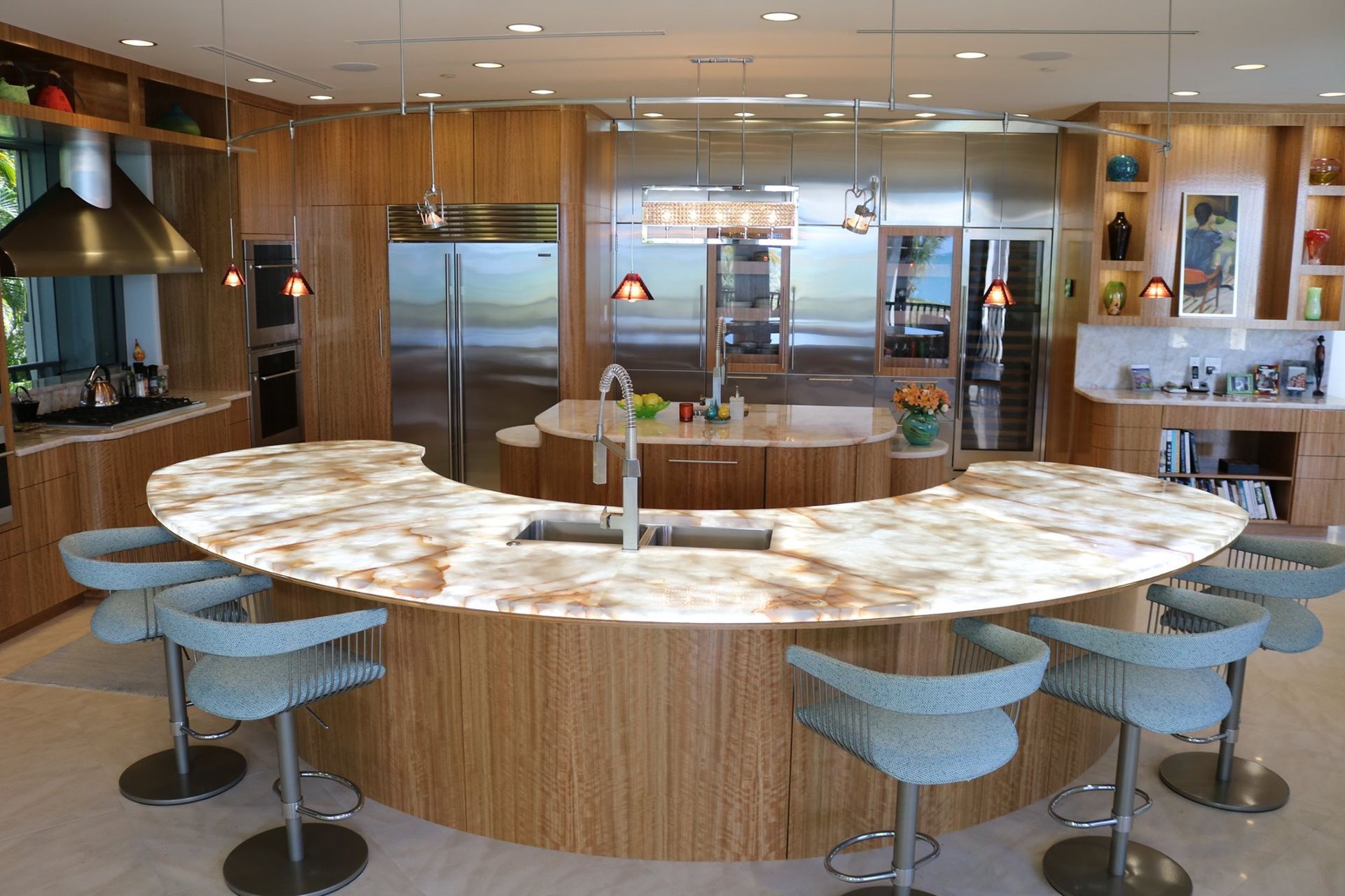 A kitchen with a large island and stools