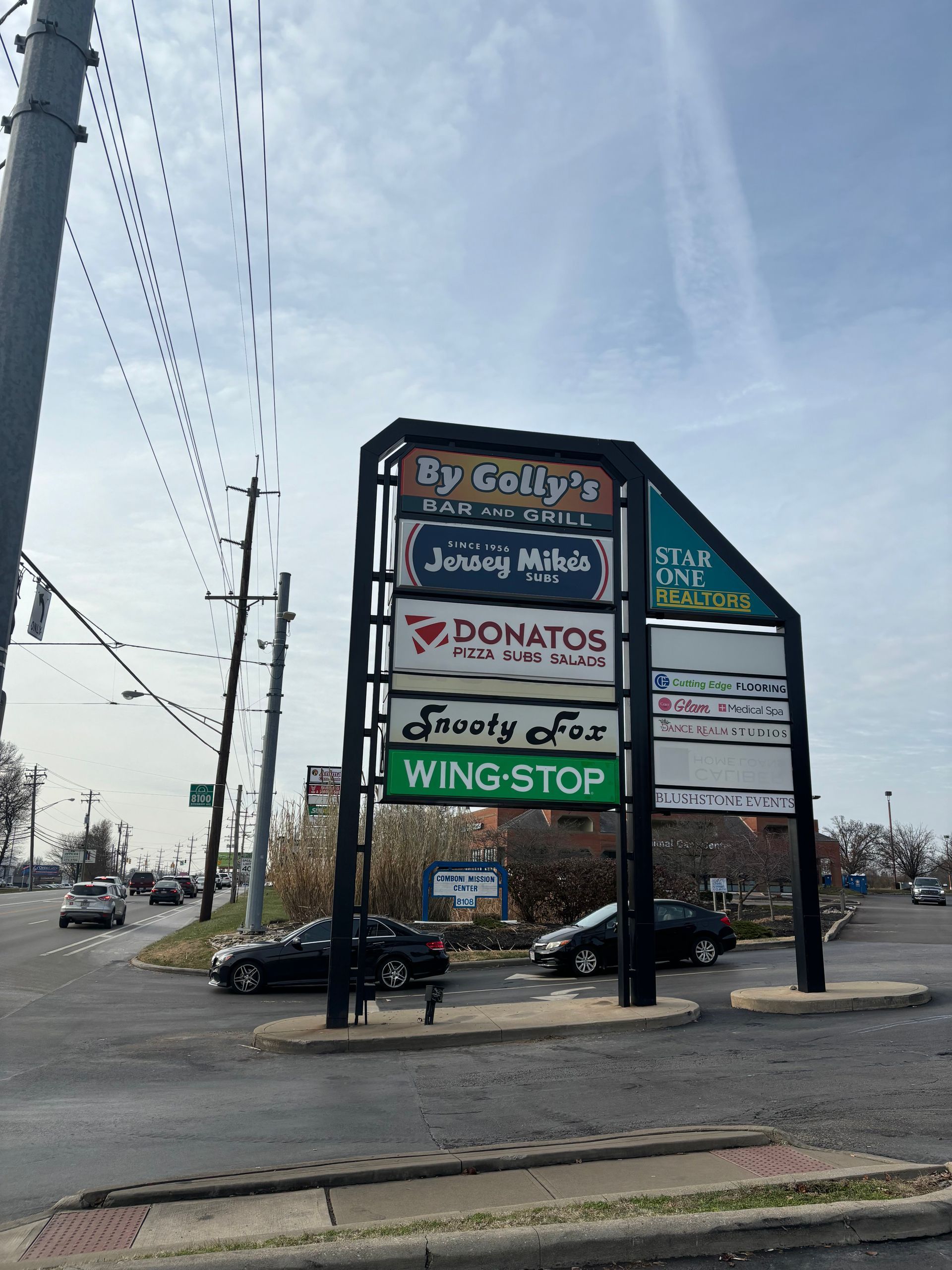 A sign for several businesses